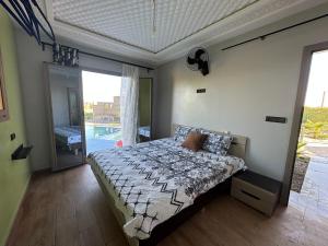 Postel nebo postele na pokoji v ubytování Ferme Marsa + 25 fotografií