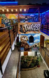 a set of stairs in a building with graffiti at Hostel THAY83 Miraflores Lima in Lima