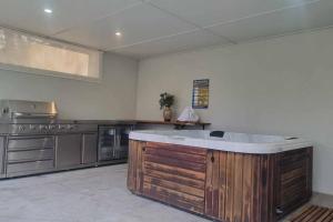 a large kitchen with a large island in the middle at Blue Mountains Sweet Retreat in Leura