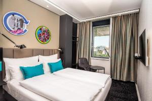 Posteľ alebo postele v izbe v ubytovaní Motel One Wien Westbahnhof