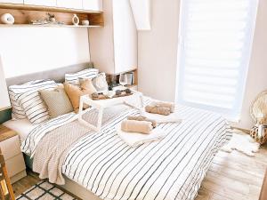 Voodi või voodid majutusasutuse Apartman WHITE toas