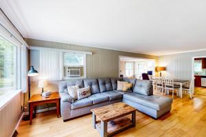 a living room with a couch and a table at Shady Acres in North Creek