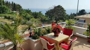 a patio with a table and chairs on a balcony at Firenze Apartments in Ulcinj