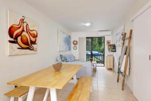a living room with a table and a couch at Ocean Sands 1 in Sawtell