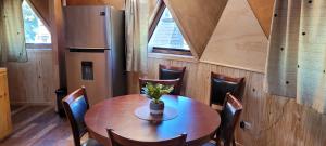 a dining room with a wooden table and chairs at Domo Familiar Mi Espacio Rustiko in San Carlos