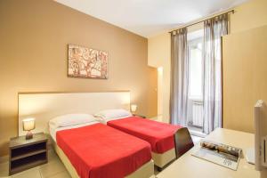 Postel nebo postele na pokoji v ubytování Hotel Mosaic Central Rome
