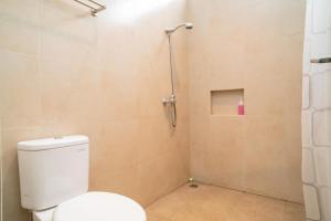 a bathroom with a toilet and a shower at 3J Home in Binong