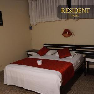 Voodi või voodid majutusasutuse Hotel Resident Piura toas