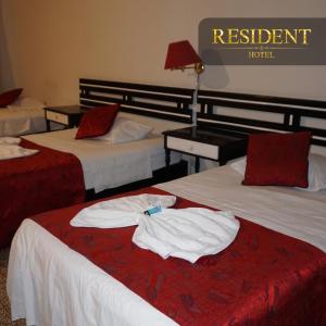 Voodi või voodid majutusasutuse Hotel Resident Piura toas
