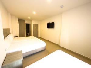 Postel nebo postele na pokoji v ubytování Hotel Zamay Plus