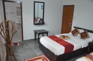 Ein Bett oder Betten in einem Zimmer der Unterkunft Hotel Blue moon Pokhara