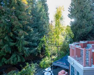 an aerial view of a yard with trees at Alpenglow Lodge Cozy Studio with Den by MVA in Whistler