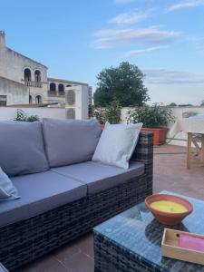 a couch sitting on top of a patio at El paller de L´Armentera 3 in Saldet
