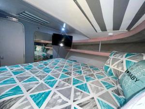a bedroom with a bed with a tiled floor at Nice Boat in Key Largo in Key Largo