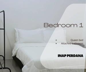 מיטה או מיטות בחדר ב-Inap Perdana Sungkai, Perak