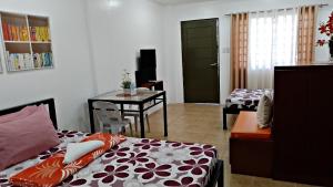 Postel nebo postele na pokoji v ubytování Maria Cristesa Condotel