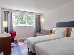 Postel nebo postele na pokoji v ubytování B&B HOTEL Cergy Port 4 étoiles + 23 fotografií