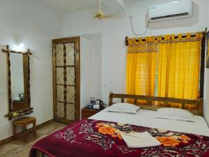Postel nebo postele na pokoji v ubytování Khoai Village Resort