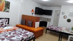 Postel nebo postele na pokoji v ubytování Maria Cristesa Condotel
