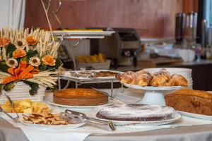 a table with different types of bread and pastries at Grande Albergo in Sestri Levante