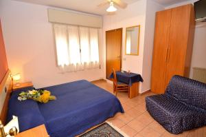 Postel nebo postele na pokoji v ubytování Hotel Amba Alagi