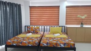 Postel nebo postele na pokoji v ubytování Maria Cristesa Condotel