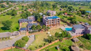 an aerial view of a large building with a yard at Dreamland Hotel in Arua