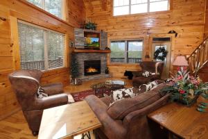 a living room with a couch and a fireplace at Hemlock Ridge 1713 in Gatlinburg