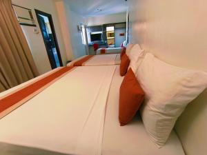 Voodi või voodid majutusasutuse Southpole Central Hotel toas