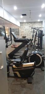 a gym with several exercise machines in a room at 1809 Sunvida Tower Condo across SM City Cebu in Cebu City