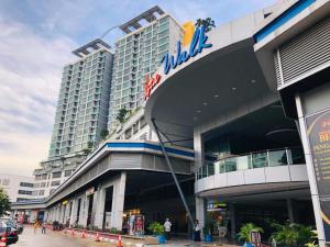 a building with a sign on the side of it at Harmoni Homes Vista Alam in Shah Alam