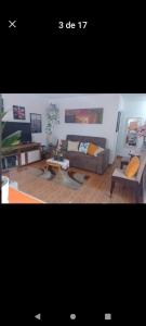 a living room with a couch and a table at Apartamento completo en San Borja in Lima