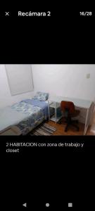 a bedroom with a bed and a desk and a chair at Apartamento completo en San Borja in Lima