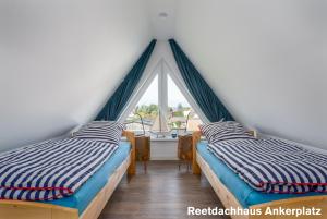 Postel nebo postele na pokoji v ubytování Reetidyll am Haff