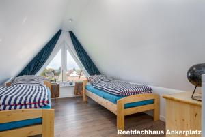 Postel nebo postele na pokoji v ubytování Reetidyll am Haff