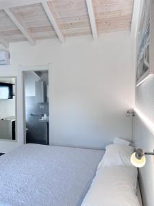 Postel nebo postele na pokoji v ubytování Longevity Hotel