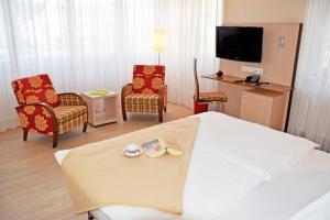 TV a/nebo společenská místnost v ubytování Appartementhaus Sellin