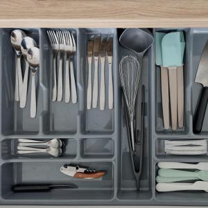a plastic container with utensils in a drawer at Seliu 25 Homestay Apartment poilsio namai in Šiauliai +15 photos
