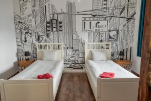 Posteľ alebo postele v izbe v ubytovaní Atelier Hostel