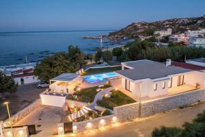 an aerial view of a house with a swimming pool at Ocean Pearl Sea View in Faliraki