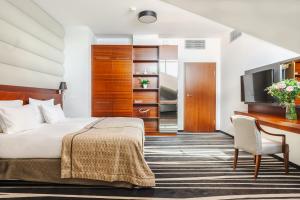 Posteľ alebo postele v izbe v ubytovaní Hotel Mikołajki Leisure & SPA - Destigo Hotels