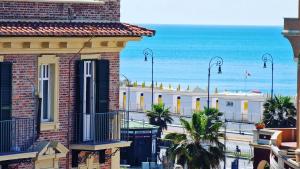 a view of the ocean from a building at Barocchetto Romano in Lido di Ostia