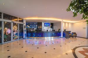 a lobby with a bar and a dance floor at Casino & Hotel ADMIRAL Kozina in Kozina