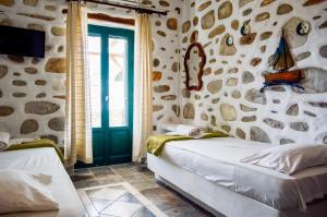 Cama ou camas em um quarto em Villa Peristeri