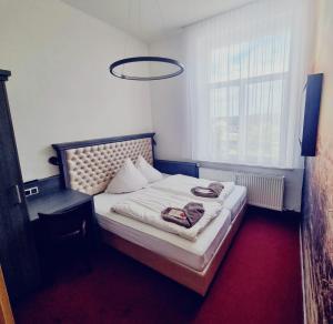Postel nebo postele na pokoji v ubytování Jägerhof Putzkau