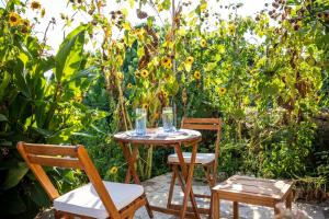 two chairs and a table with two glasses on it at Stone House Harmony in Korčula