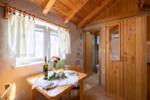 a dining room with a table and a window at Stone House Harmony in Korčula