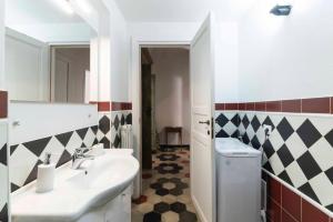 a bathroom with a sink and a toilet at Vintage Cavour Apartment in Sassari