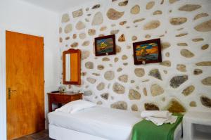 Cama ou camas em um quarto em Villa Peristeri