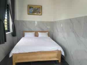Postel nebo postele na pokoji v ubytování Ánh Mai Hotel